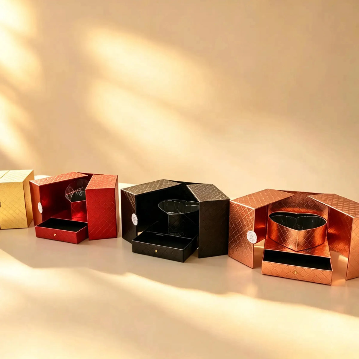 Gold quilted hexagonal gift box, shown alongside the red, black, and rose gold options.