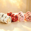 Heart-shaped gift boxes with clear window lids in white, red, pink, and peach, tied with satin ribbon bows