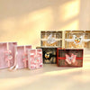 Red butterfly-accent gift box shown with the black, pink, white, and off-white colour options