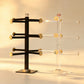 Front view of the bangle display stands showing three tiers of gold-tone-capped arms