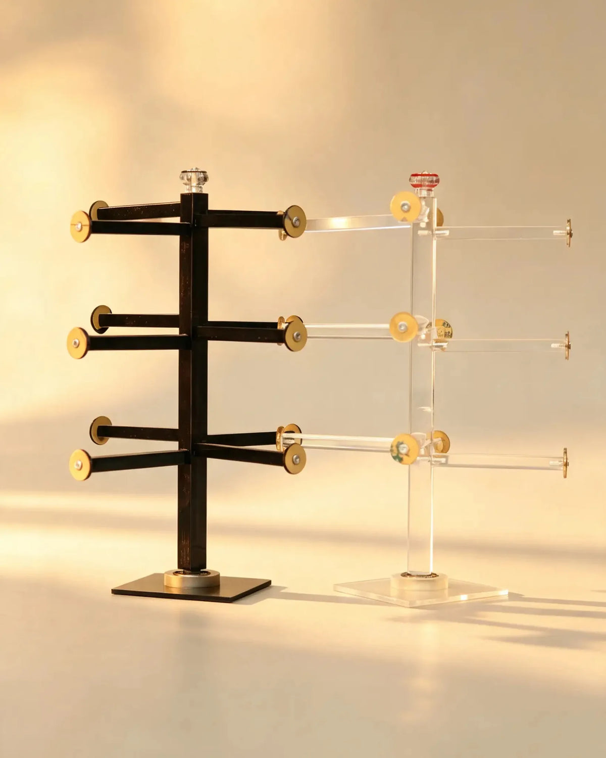 Front view of the bangle display stands showing three tiers of gold-tone-capped arms