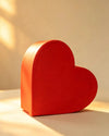 Red heart-shaped cardboard gift box, front angled view