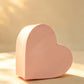 Blush pink heart-shaped cardboard gift box, front angled view