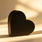 Black heart-shaped cardboard gift box, front angled view