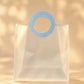 Translucent PVC tote bag with circular blue stitched handle