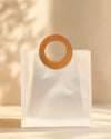 Small frosted PVC gift bag with round brown stitched handle