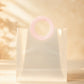 Close-up of pink round handle on clear PVC gift bag