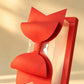 Clear PVC gift box tilted upright, showing red ribbon bow and transparent side panel