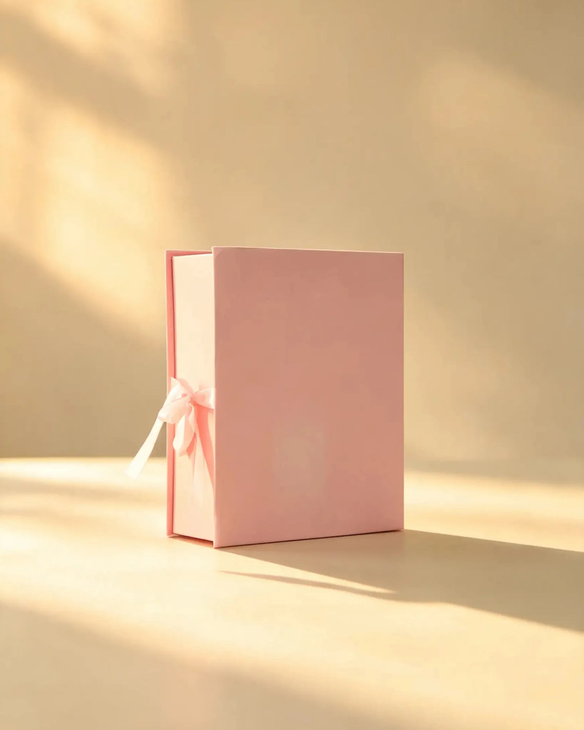 Soft pink gift box with matching pink satin ribbon bow
