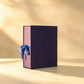 Deep plum gift box with mauve sides and blue satin ribbon bow