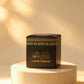 Small black Umrah Mubarak gift box with gold foil detailing on a pedestal
